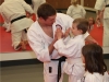 Sensei Congratulating Kids Karate Student in Ashburn VA